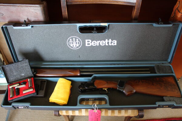 12g over & under by Beretta 28 x 2 3/4" multi-choke barrels