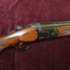 12g over & under by Beretta 28 x 2 3/4" multi-choke barrels